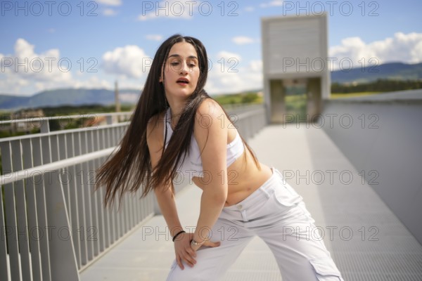 Three quarter length portrait of a caucasian beauty young woman performing urban dance in an