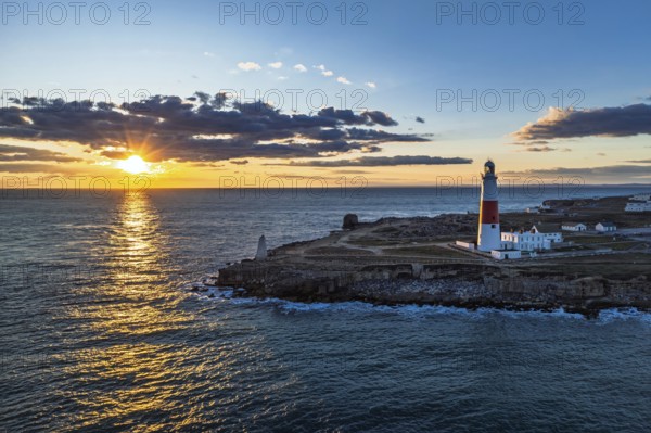 Sunset over Portland Bill Lighthouse from a drone, Portland Bill, Isle of Portland, Dorset,