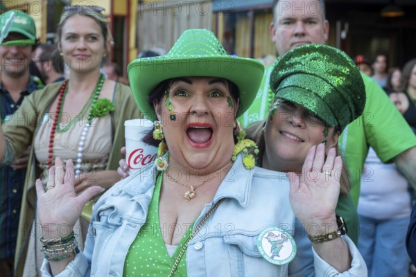 New Orleans, Louisiana - Spectators line the sidewalks as the Downtown Irish Club holds its St
