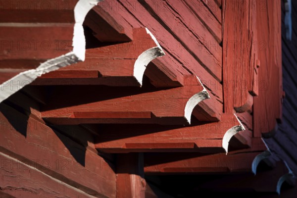Detail of falun red painted wooden construction, detail of traditional Norwegian wooden granary or