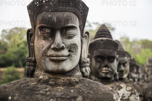 Figures on the bridge to Angkor Thom, sunset, Angkor Wat, Angkor, UNESCO World Heritage Site, Siem