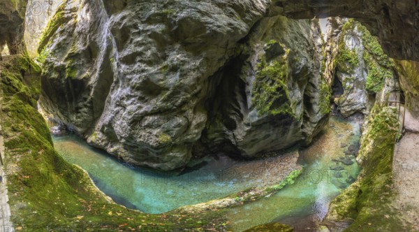 Scenic landscape showing tolmin gorges carving through rock formations with crystal clear turquoise