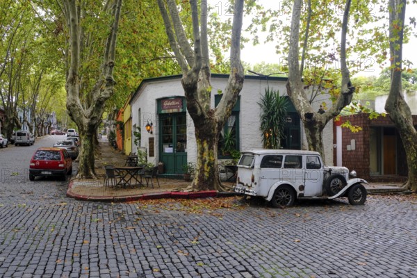 Colonia del Sacramento, Colonia, Uruguay, vintage cars parked in the alleyways of the old town.