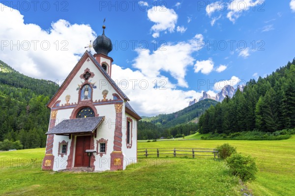 Scenic view of the st. Magdalena church with the odle mountains in the background, a popular