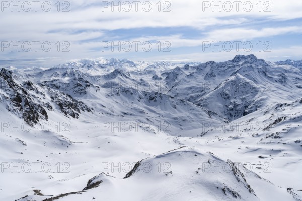 Mountain panorama with view of peaks of the Bernina group, view from Piz Grialetsch in winter,