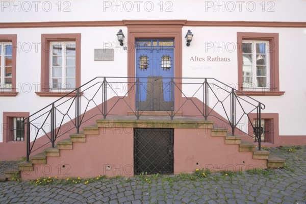 Entrance with staircase to the historic Old Town Hall built in 1717, inscription, red building,