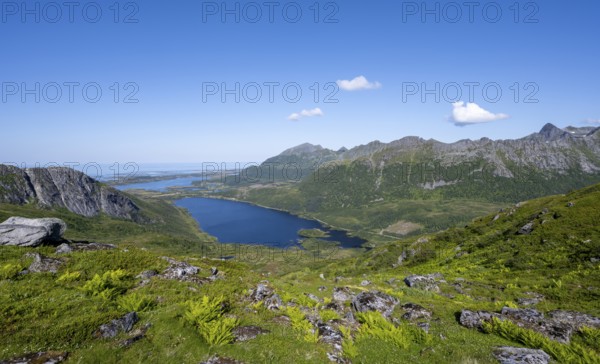 View of mountain landscape and valley with lakes, hiking trail to the summit of Rundfjellet,