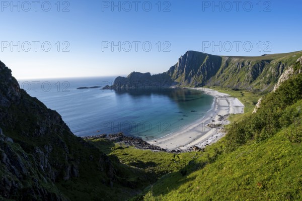 View of coastal landscape, cliffs with peak Måtind, Høyvika beach and sea, hike to the peak of