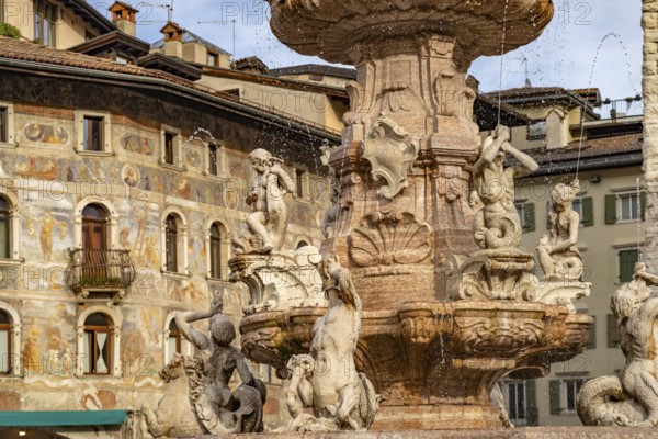 Fountain of Neptune and the painted façade of the Case Cazuffi Rella houses on Piazza del Duomo in