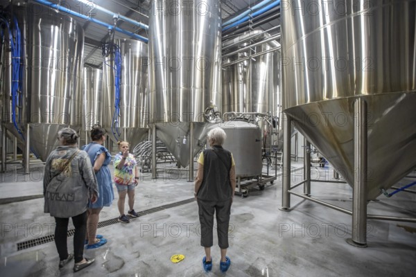 Covington, Louisiana - The Abita Brewing Company's craft beer brewery. A tour guide explains the