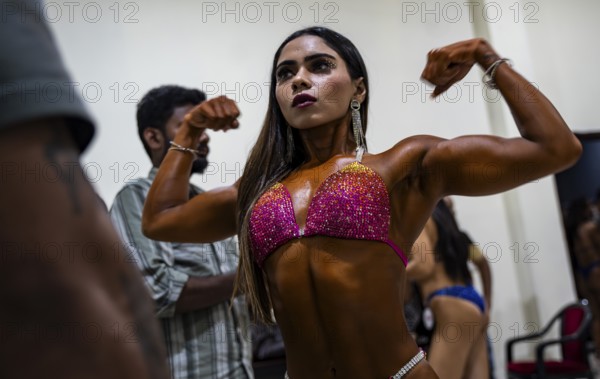 Female participants gets ready backstage as they prepare for the 4th Ms Saraighat all India classic