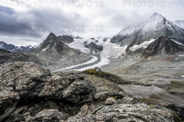 Mountain hut Cabane des Dix in front of glacier Glacier de Cheilon and summit Mont Blanc de