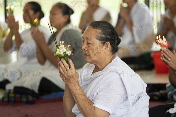 NAMSAI, INDIA.- APRIL 16: Devotees celebrate the vibrant Sangken Festival at Golden Pagoda in