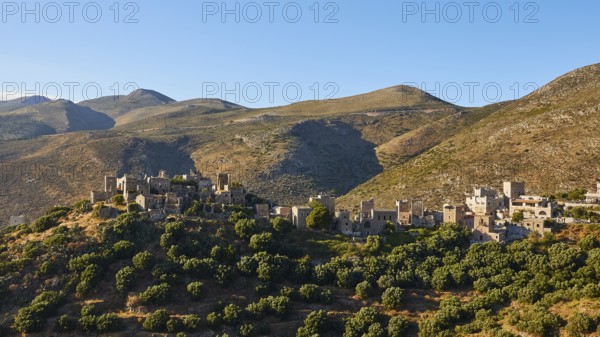 Historic village on sunlit hills, Vathia, residential tower village, Mani peninsula, Peloponnese,