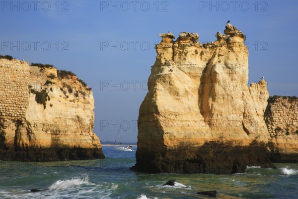 Praia do Pinhao, Lagos, Algarve, Portugal, Majestic coastal landscape with steep cliffs and a