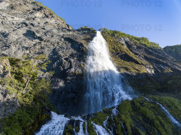 Waterfall at the Bay of Last Hope, fjords and mountains, Puerto Natales, Patagonia, Chile, South