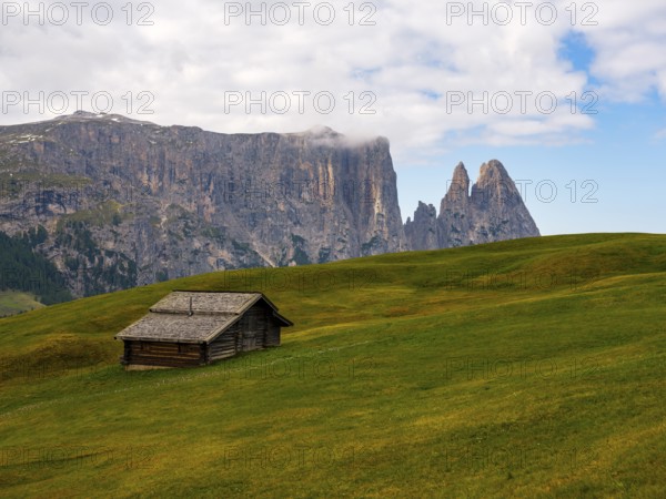 Alpine hut in front of the Sciliar, Punta Santner, Dolomites, Alpe di Siusi, South Tyrol, Italy,