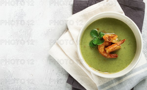 Pea cream soup, with shrimp, green soup, homemade, top view, no people