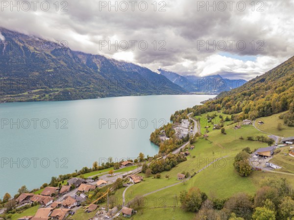 Sweeping views over a large lake with surrounding mountains, villages and meadows, Lake Brienz.