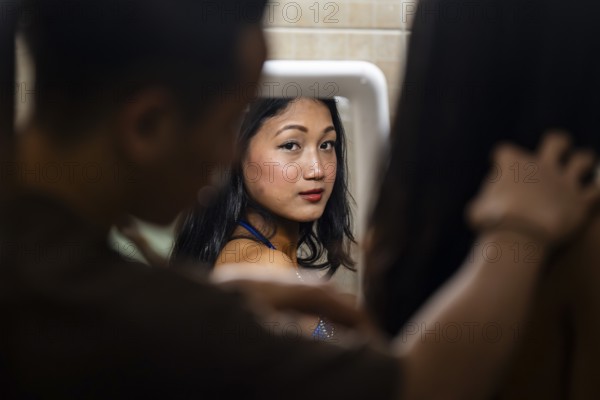 Female participants gets ready backstage as they prepare for the 4th Ms Saraighat all India classic