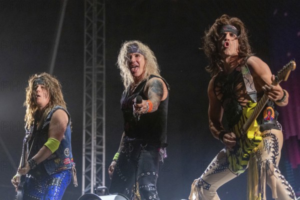 Copenhagen, Denmark - 19.6.2024: Spyder (bassist), Michael Starr (singer) and Satchel (guitarist)