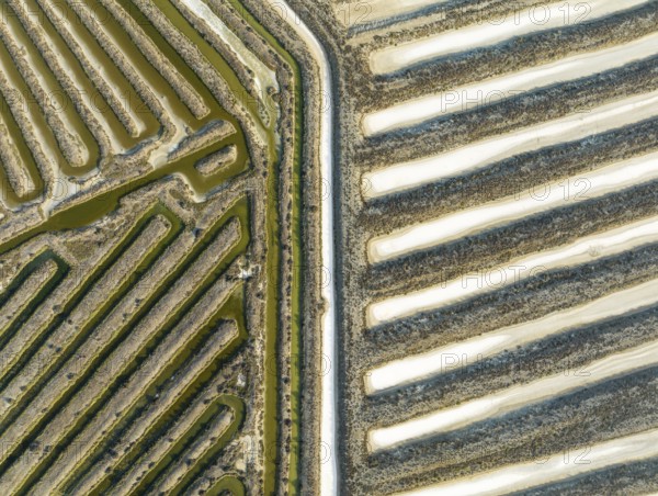 Saline ponds at the salt works near Chiclana de la Frontera. Aerial view. Drone shot. Cádiz