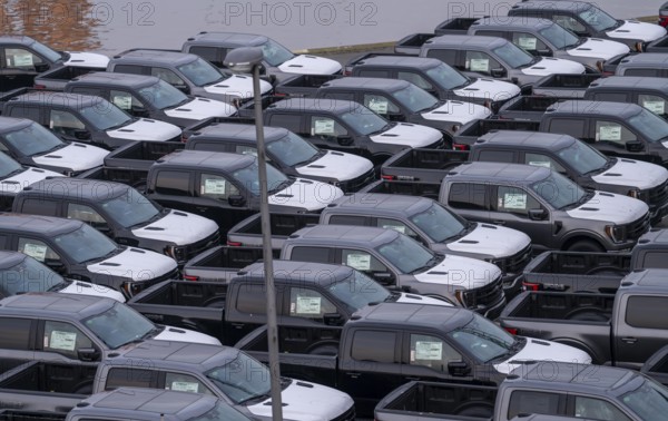 Ford FX4 pickup trucks on stockpile, in the overseas harbour of Bremerhaven, after import from the