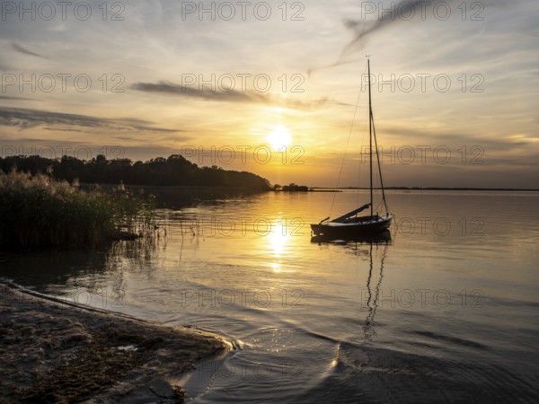 Sunset at lake Müritz, beach of village Rechlin, Müritz National Park, Germany, Europe