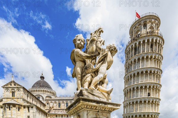 Statue of angels, behind the Leaning Tower and the Cathedral of Santa Maria Assunta, Pisa, Tuscany,