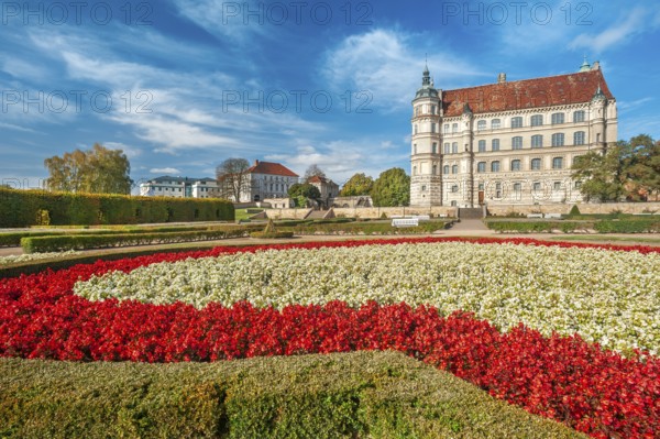 Güstrow Castle in autumn with colourful flower beds, built in the 16th century, Renaissance