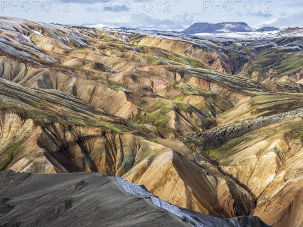 Early snow on the colorful rhyolite mountains, Landmannalaugar, Fjallabak Nature Reserve, Iceland,