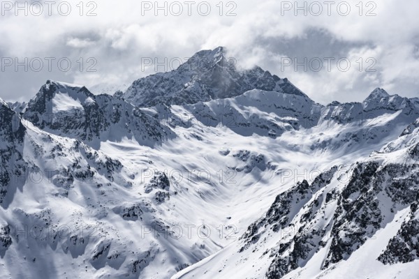 View at the summit of Piz Laviner, mountain panorama in winter, mountain landscape with mountain