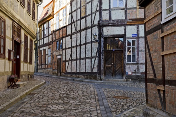 Half-timbered houses in the Finkenherd alley with cobblestones, Old Town of the World Heritage town