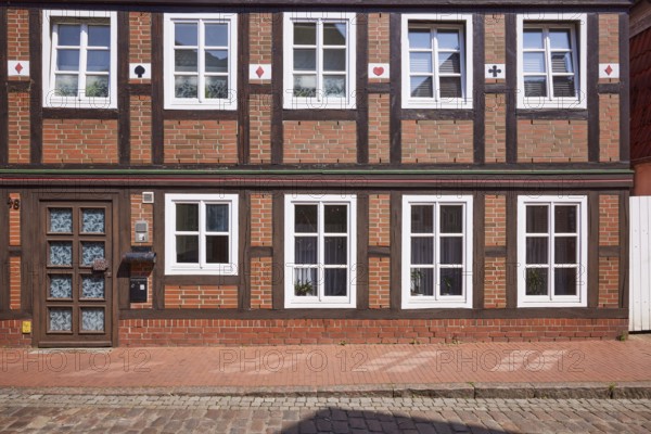 Façade with door and windows of a half-timbered house in Stade, Hanseatic city, district of Stade,