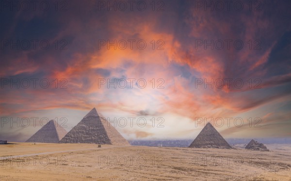Pyramids of Giza at sunset, the oldest Funerary monument in the world. In the city of Cairo, Egypt,