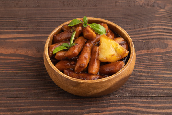 Tteokbokki or Topokki, fried rice cake stick, popular Korean street food with spicy jjajang sauce