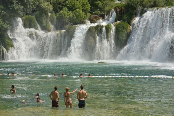Tourists taking a bath at the Skradinski buk waterfalls, Krka National Park, Šibenik-Knin County,