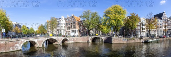 Canals and bridges building panorama at the Keizersgracht in the city of Amsterdam, Netherlands