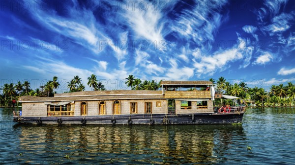 Kerala India travel background, panorama of tourist houseboat on Kerala backwaters. Kerala, India,