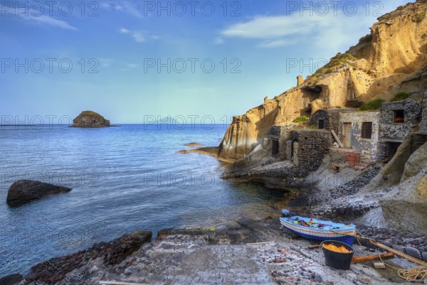 Houses in the rock, pebble beach, boat, sandstone rocks, Filicudi, Scoglio Faraglione, Spiaggia di