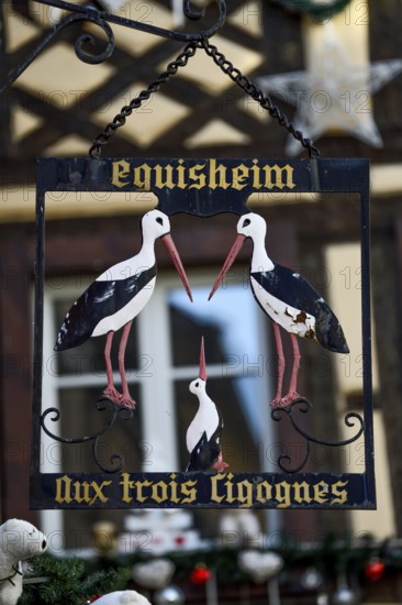 Sign at the restaurant Aux Trois Cigognes, Eguisheim, Département Haut-Rhin, Region Grand Est,