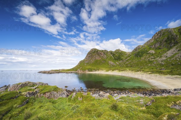 Sandy beach beach in bay with mountains, Skipssanden, near Stø, Dronningruta hike, Langøya Island,