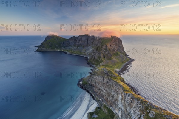 View from Håheia or Håen mountain to mountains and coast, evening mood, Måstad peninsula, Værøy