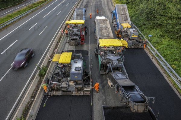 Essen, North Rhine-Westphalia, Germany, Road construction, Asphalt pavers and road rollers lay new,
