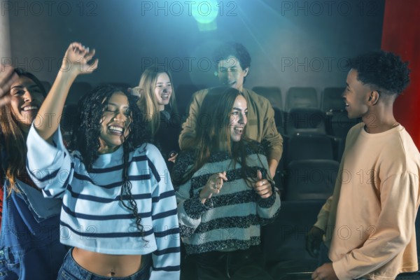 Cheerful young people dancing and having fun at a movie disco event, enjoying music and