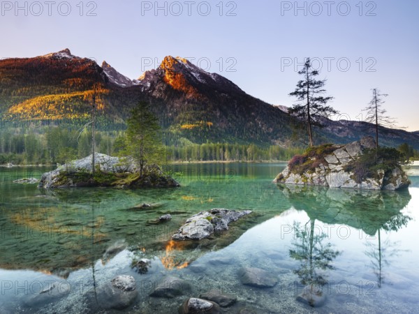 Hintersee in the morning, behind the peaks of the Hochkalter in the first sunlight, Berchtesgaden