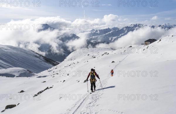 Ski tourers in a wintry mountain landscape, Bündner Haute Route ski tour, Albula Alps, Rhaetian