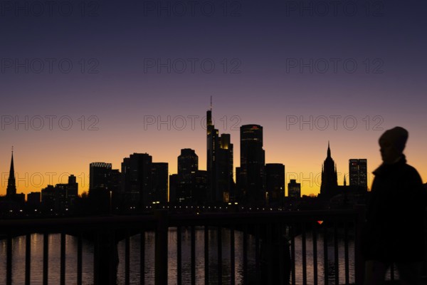 The silhouette of Frankfurt's banking skyline stands out in the evening against the residual light