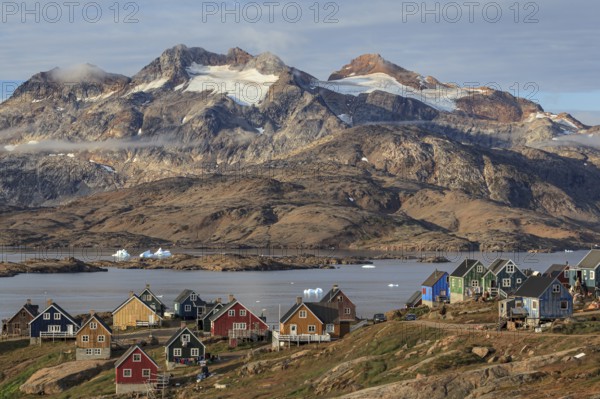 Inuit settlement at a fjord with icebergs, mountainous, autumn, sunny, Tasiilaq, East Greenland,