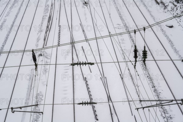 Onset of winter with lots of fresh snow and temperatures below -5 degrees during the day, railway